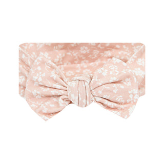 Lou Lou and Company Headband - Louise
A dusty pink fabric headband with a white floral pattern, featuring a large front knot, shown against a plain white background.