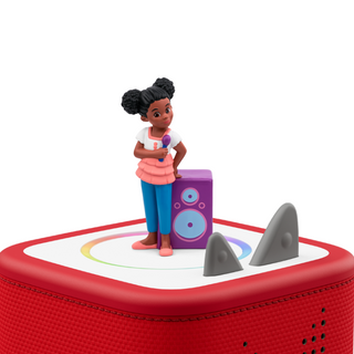 Tonies Character: Gracie's Corner
Toy figure of a girl with a microphone standing on a red toy set with speakers.