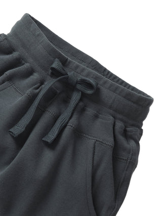 Little Bipsy Jogger - Shadow
Dark gray sweatpants with a drawstring on a light gray background