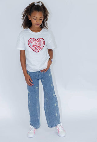 Lola and The Boys Crystal Stars Jeans Young girl wearing a white t-shirt with a red heart design and blue jeans on a white background