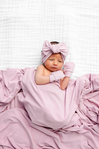 Lou Lou and Company Ribbed Headband - Haven
Newborn baby wrapped in pink blanket and headband on white background