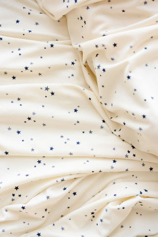 Lou Lou and Company George swaddle blanket with soft fabric and playful geometric pattern for newborns and babies.