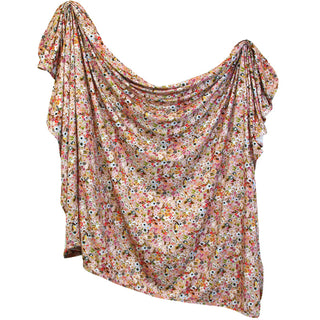 Lou Lou and Company Penelope swaddle blanket with soft fabric and floral pattern, designed for comfortable swaddling.