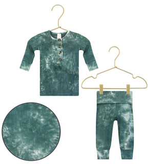 Lou Lou and Company Top and Bottoms - Mateo
Tie-dye baby outfit with shirt and pants on hangers against a white background