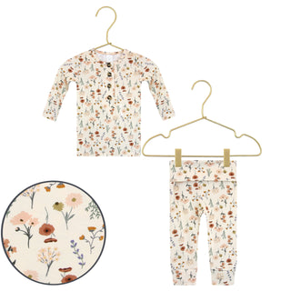 Lou Lou and Company Top and Bottoms - Rachel
Floral-patterned baby outfit with shirt and pants on hangers against a white background.