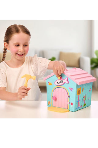 Little Live Pets™ Kitty’s Home Minis with Buildable House
Child playing with a colorful toy house and hammer on a light-colored surface.