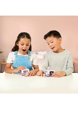 Little Live Pets™ Mama Surprise Families Adoption Pack with 2-4 Babies
Two children playing with toy building blocks on a light-colored surface.