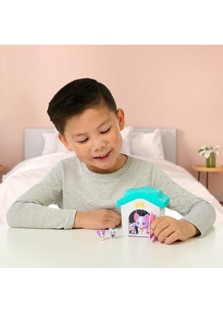 Little Live Pets™ Mama Surprise Families Mama’s House Toy
Child playing with a toy house on a bed