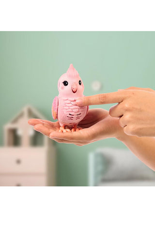 Little Live Pets™ My Really Real Bird Interactive Bird Toy
Pink plush toy resembling a bird held in a hand against a light green background