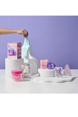 Gui Gui™ Surprise Slime Kit with Mini Figure & Charms
Product display with various items on a white surface against a purple background