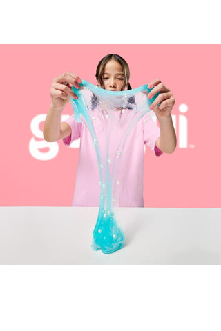 Gui Gui™ Surprise Slime Kit with Mini Figure & Charms
Person stretching blue slime in front of a pink background with 'slime' text.