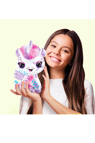 Kids playing with Airbrush Plush Glow-in-the-Dark Magic Unicorn Kit by License 2 Play, featuring colorful unicorn plush toys and airbrush tools.