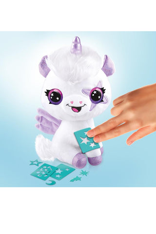 Colorful plush unicorn toy from the Airbrush Plush™ Glow-in-the-Dark Magic Unicorn Kit by License 2 Play, shown with airbrush tools.