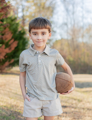 Properly Tied Boys Inlet Polo shirt featuring a classic design and touch of sporty style, displayed on a hanger.