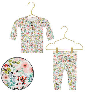 Lou Lou and Company Top and Bottoms - Millie
Floral-patterned baby outfit with shirt and pants on hangers against a white background.