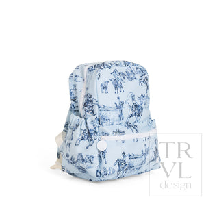 TRVL Designs Mini Backer - Cowboy Toile
A light blue backpack with a dark blue toile de Jouy print featuring horses and figures, shown on a plain white background with a 'TRVL design' watermark.