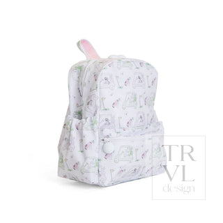 TRVL Designs Mini Backer - Putt Putt Pink
A small white backpack with a pastel cartoon pattern of bunnies, carrots, and a pink rabbit ear, shown on a white background with a 'TRVL design' watermark.