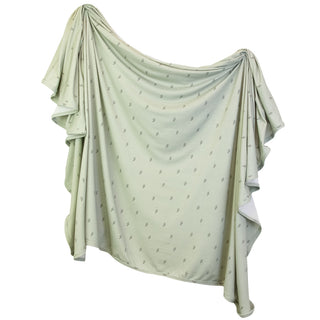 Lou Lou and Company Knit Swaddle Blanket - Nash
Light green fabric with subtle pattern draped over a white background