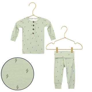 Lou Lou and Company Knit Top and Bottoms - Nash
Children's green outfit with long-sleeve shirt and pants on hangers against a white background.