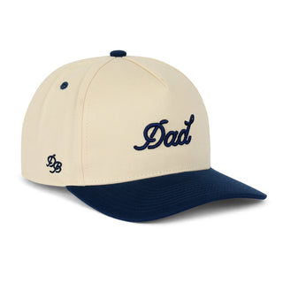 Dad Brand Dad Snapback | Cream & Navy
Beige and navy cap with 'Dad' text on a white background