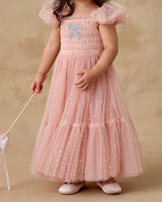 Noralee Clara Dress - Rose
Child wearing a pink dress with a butterfly design on a beige background