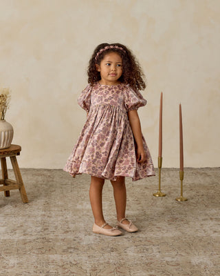 Noralee Luna Dress - Harvest Fleur
Young girl in a floral dress standing in a room with candles and a vase.