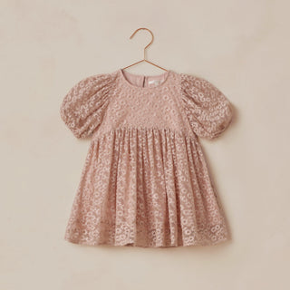 Noralee Luna Dress - Rose Embroidered Daisy
Pink floral dress on a hanger against a beige background
