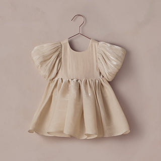 Noralee Sofia Dress - Ecru
Beige dress with puff sleeves on a hanger against a beige background