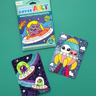 Ooly Undercover Art Monster Aliens hidden pattern coloring activity art cards on display
