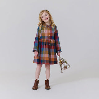 Pink Chicken Girls Autumn Dress - Harvest Check
Young girl wearing a plaid dress holding dried flowers against a plain background