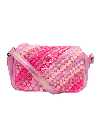 Bari Lynn Quilted Full Charm Handbag - Pinks
A pink sequined shoulder bag with a strap, featuring rows of pink heart and flower-shaped sequins on a plain white background.