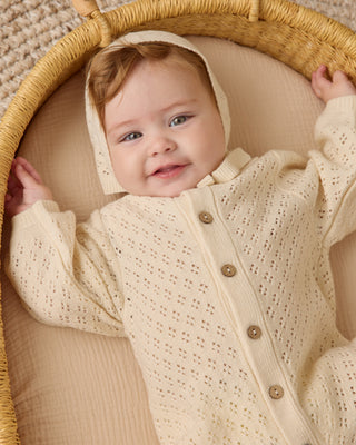Quincy Mae Bubble Romper - Natural
Baby in a textured outfit lying in a woven basket