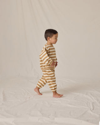 Quincy Mae Oversized Crew Sweatshirt & Oversized Sweatpant Set - Gold Stripe
Child wearing a striped outfit on a plain background