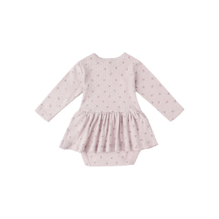 Quincy Mae Pointelle Skirted Bodysuit - Lilac
Pink baby dress with long sleeves on a white background