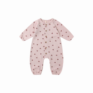 Quincy Mae Waffle Long Sleeve Jumpsuit - Hearts
Pink baby onesie with heart pattern on a white background