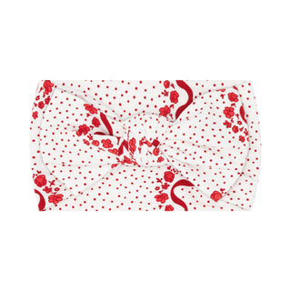 In My Jammers vintage headband with red bow, floral design, and soft fabric for a charming, retro-inspired accessory.