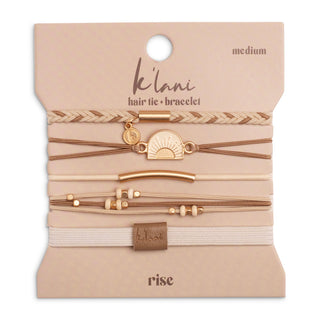 K'lani "Rise" Cream and Tan With Gold and Sun Hair Tie Bracelets
Packaged hair tie and bracelet set with 'Ik'lani' branding on a beige background