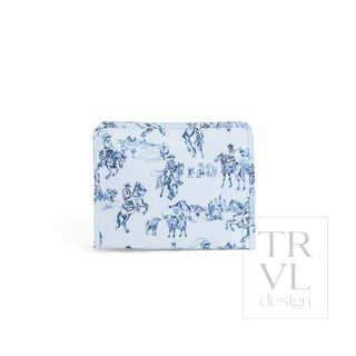 TRVL Designs Roadie Large Zip Pouch - Cowboy Toile
A small fabric pouch or wallet with a light blue and navy blue toile de Jouy pattern featuring horses and riders, shown on a plain white background with a 'TRVL design' watermark.