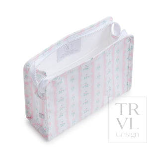 TRVL Designs Roadie Medium Zip Pouch - Ribbon Floral Pink
Striped fabric baby crib bumper with 'TRVL design' branding on a white background