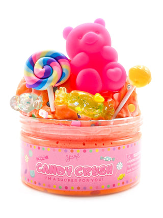 Young Wild and Friedman Slime - Candy Crush 
Pink container filled with candy-themed toys on a white background