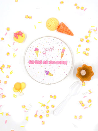 Young Wild and Friedman Slime - Go Shawty It’s Sherbet Day!
Decorative plate with ice cream cone design and text, surrounded by colorful candies on a white background