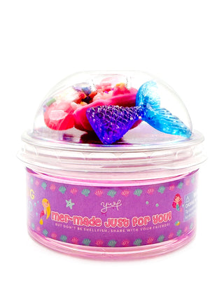 Young Wild and Friedman Slime -  Mer-Made Just for You
Clear container with colorful butterfly toys on a white background