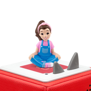 Tonies Character - Ms. Rachel Toy figure of a girl in blue overalls sitting on a red and white toy boat with shark fins.
