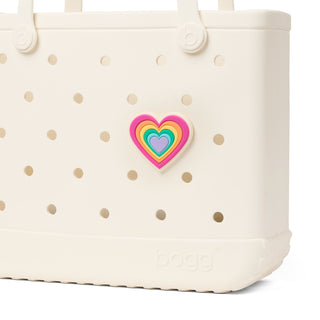 Bogg Bit - Spring Love: Layered Heart
White polka dot bag with a colorful heart-shaped patch on a white background