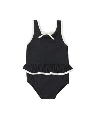 Black Rylee & Cru swimsuit with skirted design, featuring a one-piece style and comfortable straps for a stylish swim look.