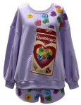 Queen of Sparkles KIDS Queenhearts Candy Box Sweatshirt - Lavender
Children's outfit with a colorful design on a light purple background