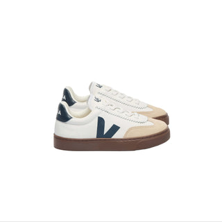 White VEJA Kids Volley sneakers with leather upper and elastic laces, featuring navy and bark accents.