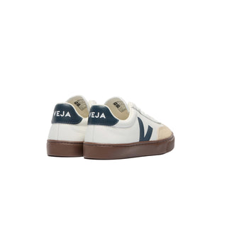 White VEJA Kids Volley sneakers with elastic laces and leather in a white and navy colorway, stylish and comfortable for children.