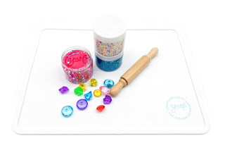 Young Wild and Friedman silicone slime mat with colorful designs, ideal for crafting and slime mixing.