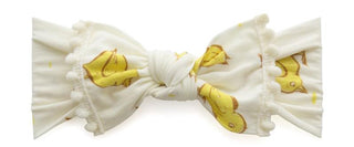 Baby Bling Chicks ivory pom-trimmed knot headband with soft fabric and decorative pom embellishments for babies.